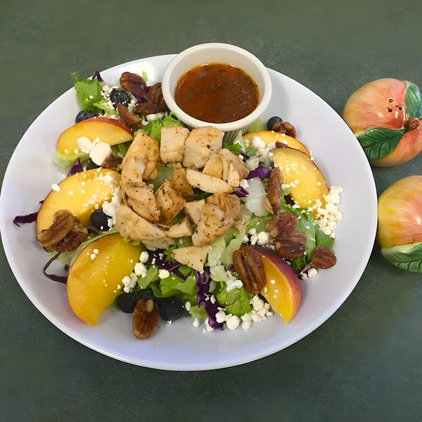 Shakers American Café's chicken salad with peaches, blueberries, pecans, and feta cheese.